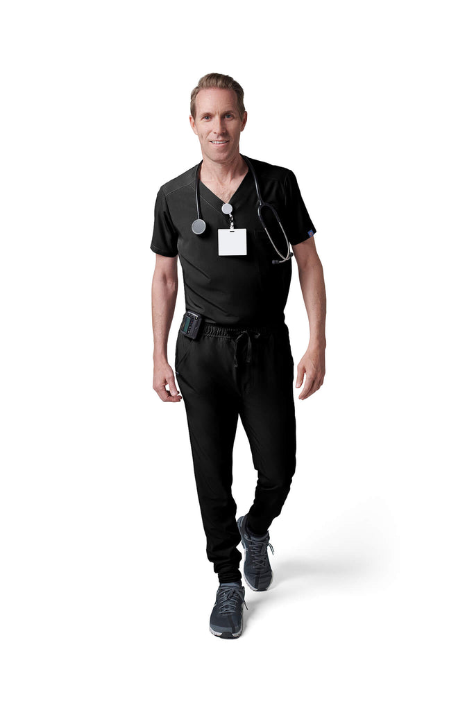 Man wearing MedTailor men's scrub pants in Jet Black color fabric