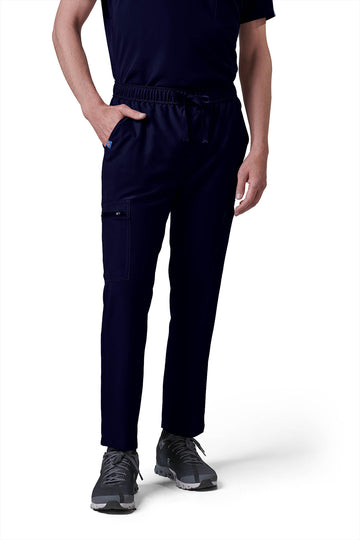 Man wearing MedTailor men's custom scrub pants in Navy Blue color fabric