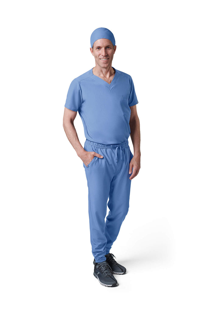 Man wearing MedTailor men's scrub cap in Sky Blue color fabric