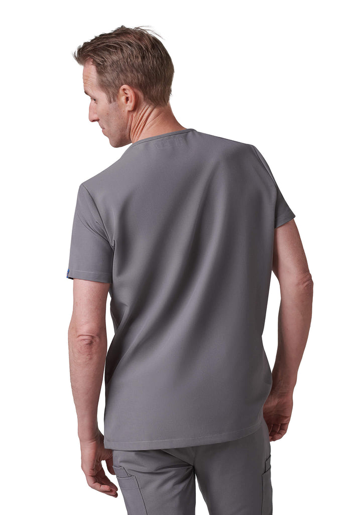 Man wearing MedTailor men's scrub top in Platinum Gray color fabric