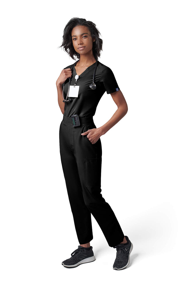 Woman wearing MedTailor women's scrub pants in Jet Black color fabric