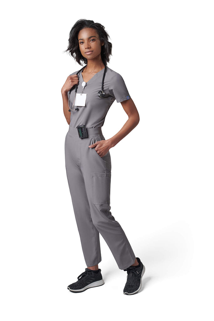 Woman wearing MedTailor women's scrub pants in Platinum Gray color fabric