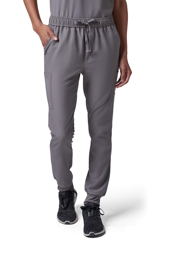 Woman wearing MedTailor women's scrub pants in Platinum Gray color fabric