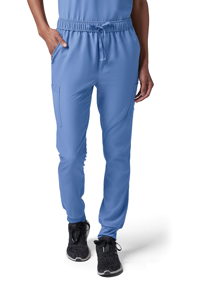 Woman wearing MedTailor women's scrub pants in Sky Blue color fabric